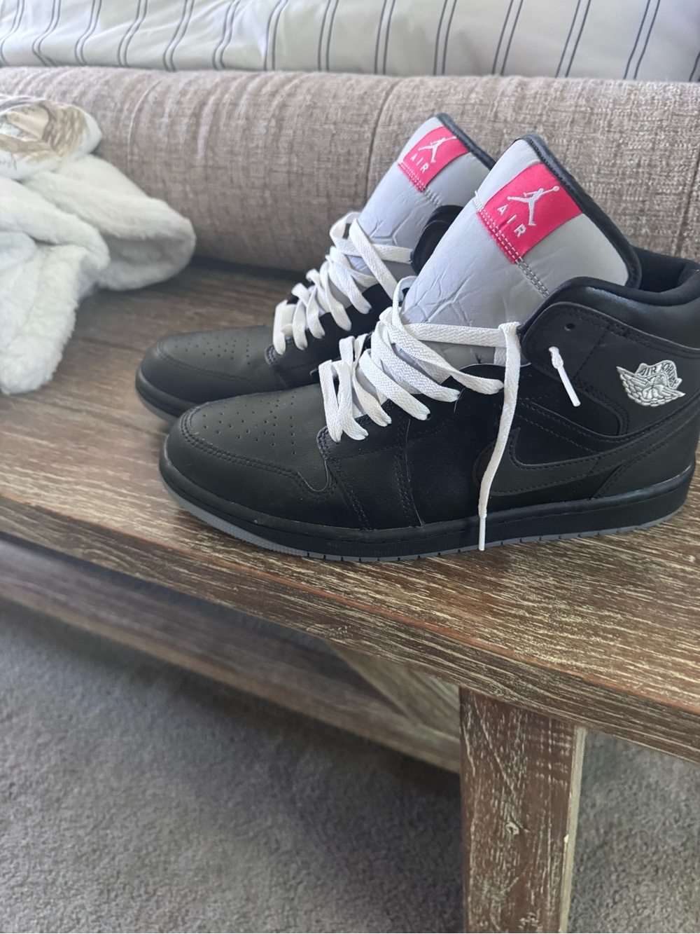 Jordan Black High-Top Sneakers with White Laces and Pink Tongue Patch